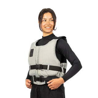 Women wearing a gray weighted vest on a Axopar Kayak or Sailing Adventure Vest